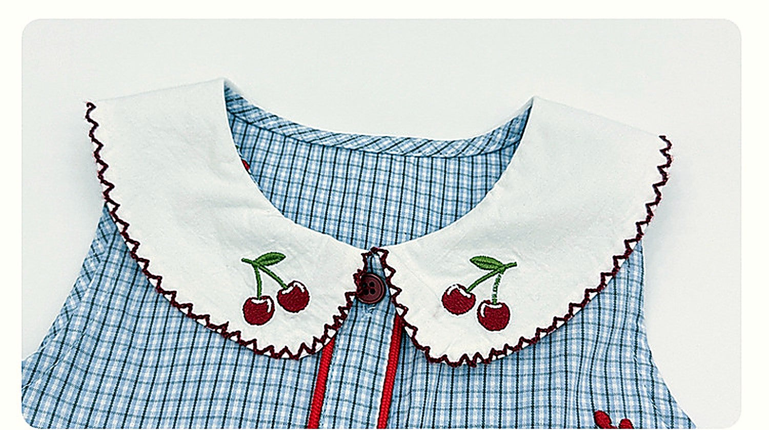 Close detail of the embroidered collar of the Bluebell Pinafore.