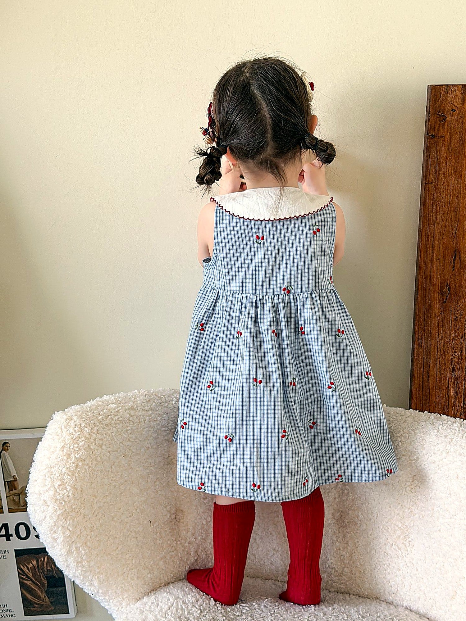 Front of the Bluebell Pinafore — white doll collar and button front in blue stripe.