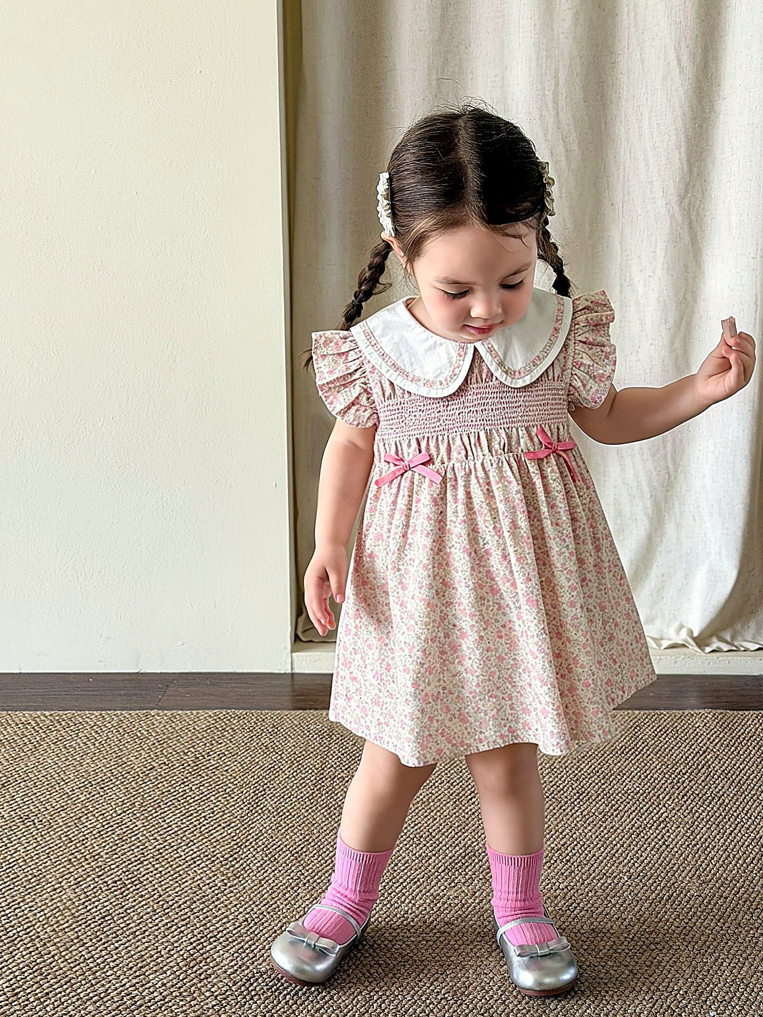 Front of the Campion Dress — lace collar, puff sleeves and a smocked bodice in warm-pink cotton.