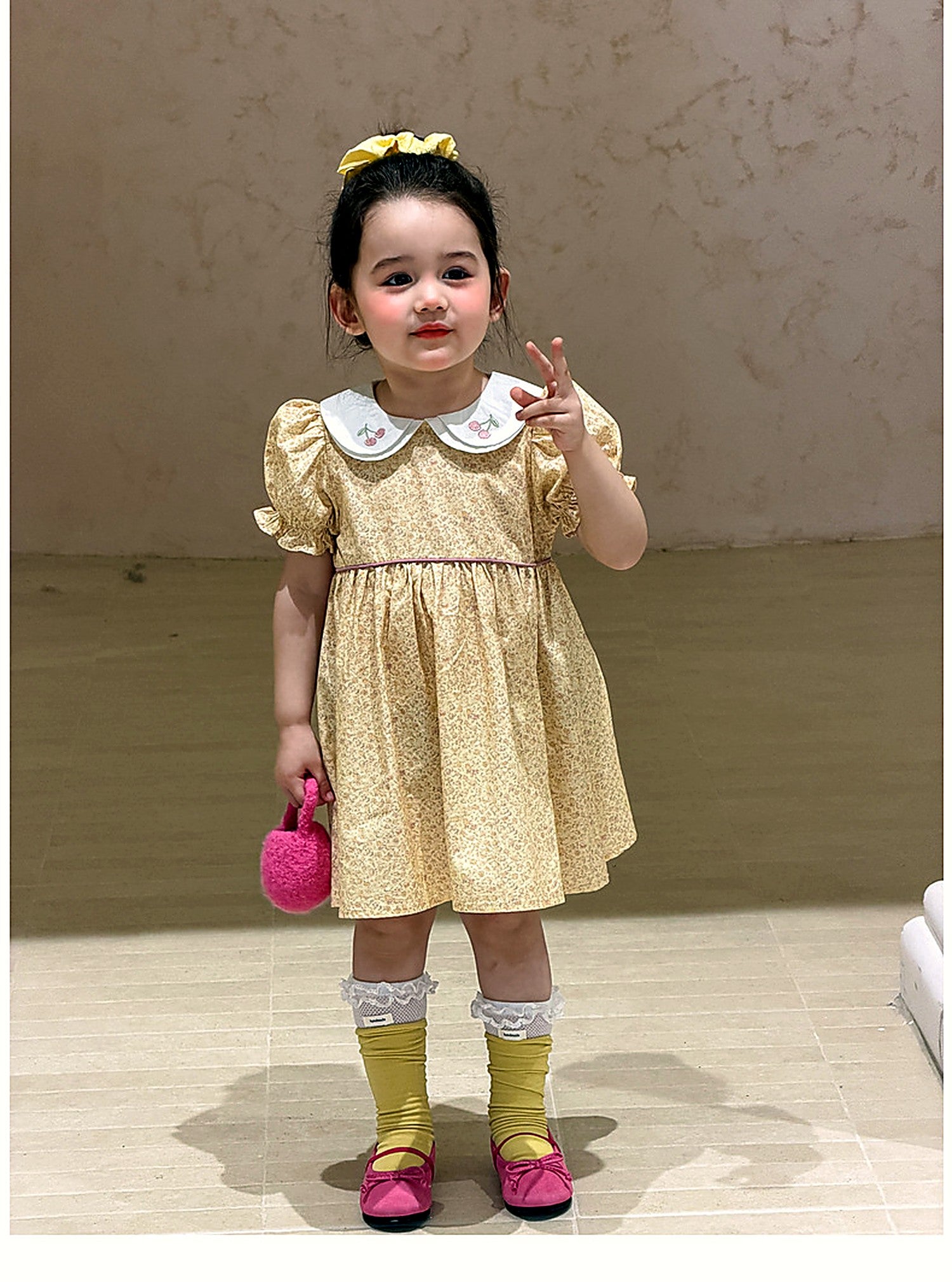The butter-yellow Cowslip Dress in washed cotton.