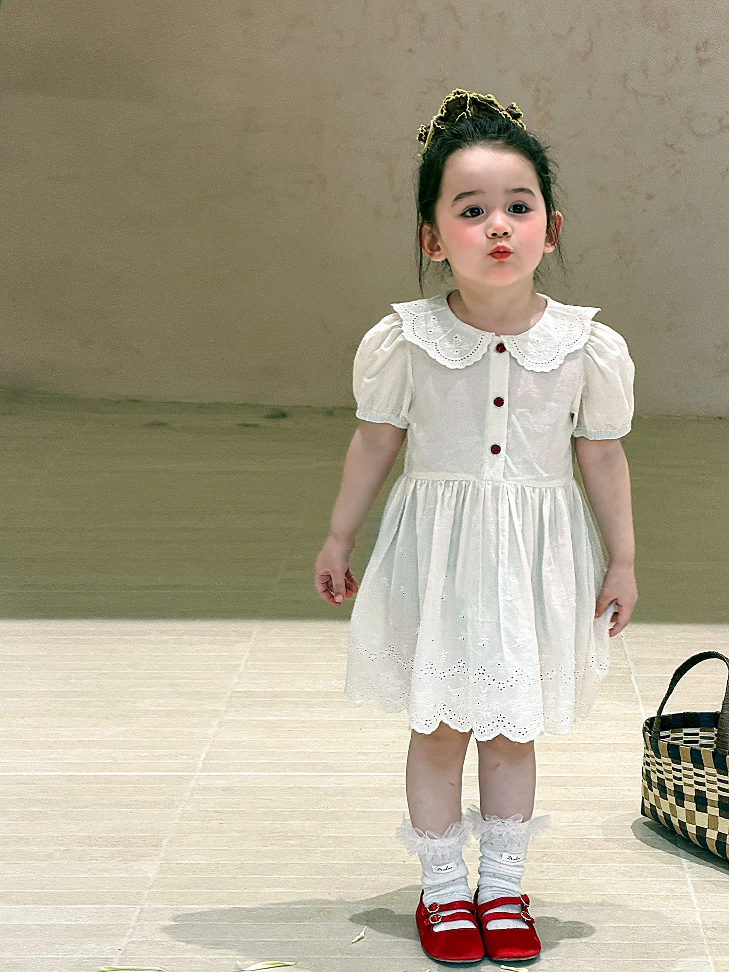 Front of the Daisy Dress — lace collar and eyelet in ivory cotton.