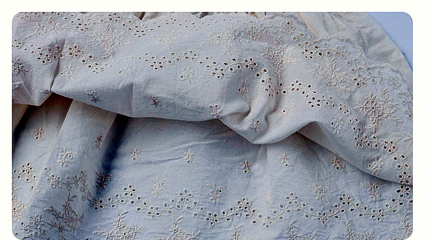 The ivory Daisy Dress in washed eyelet cotton.