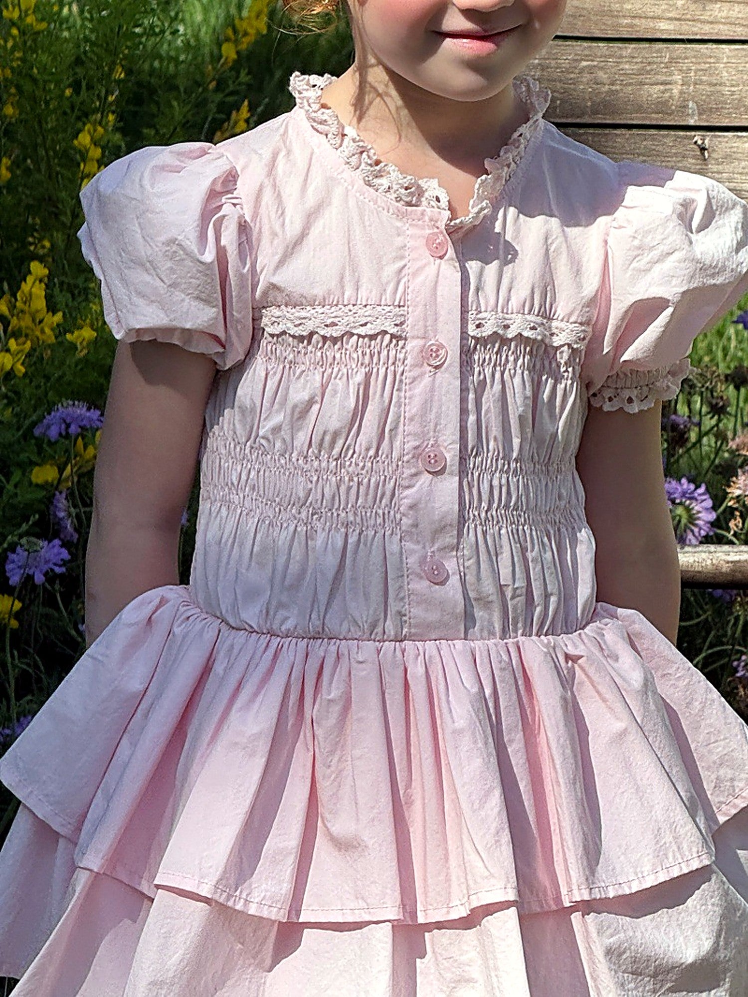 Close detail of the smocked bodice of the Foxglove Dress.