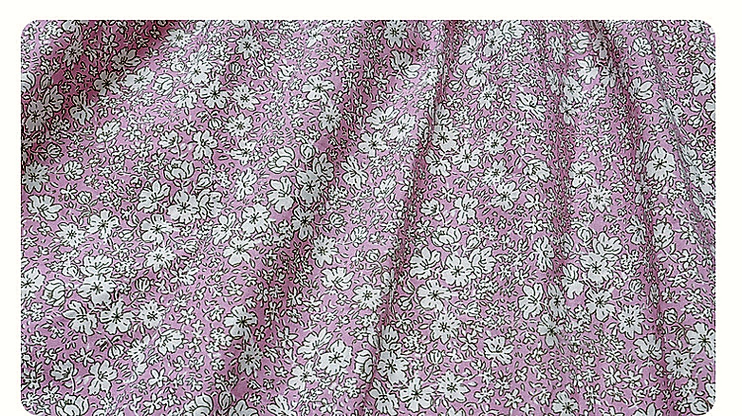The dusty-pink Hazel Dress in washed cotton.
