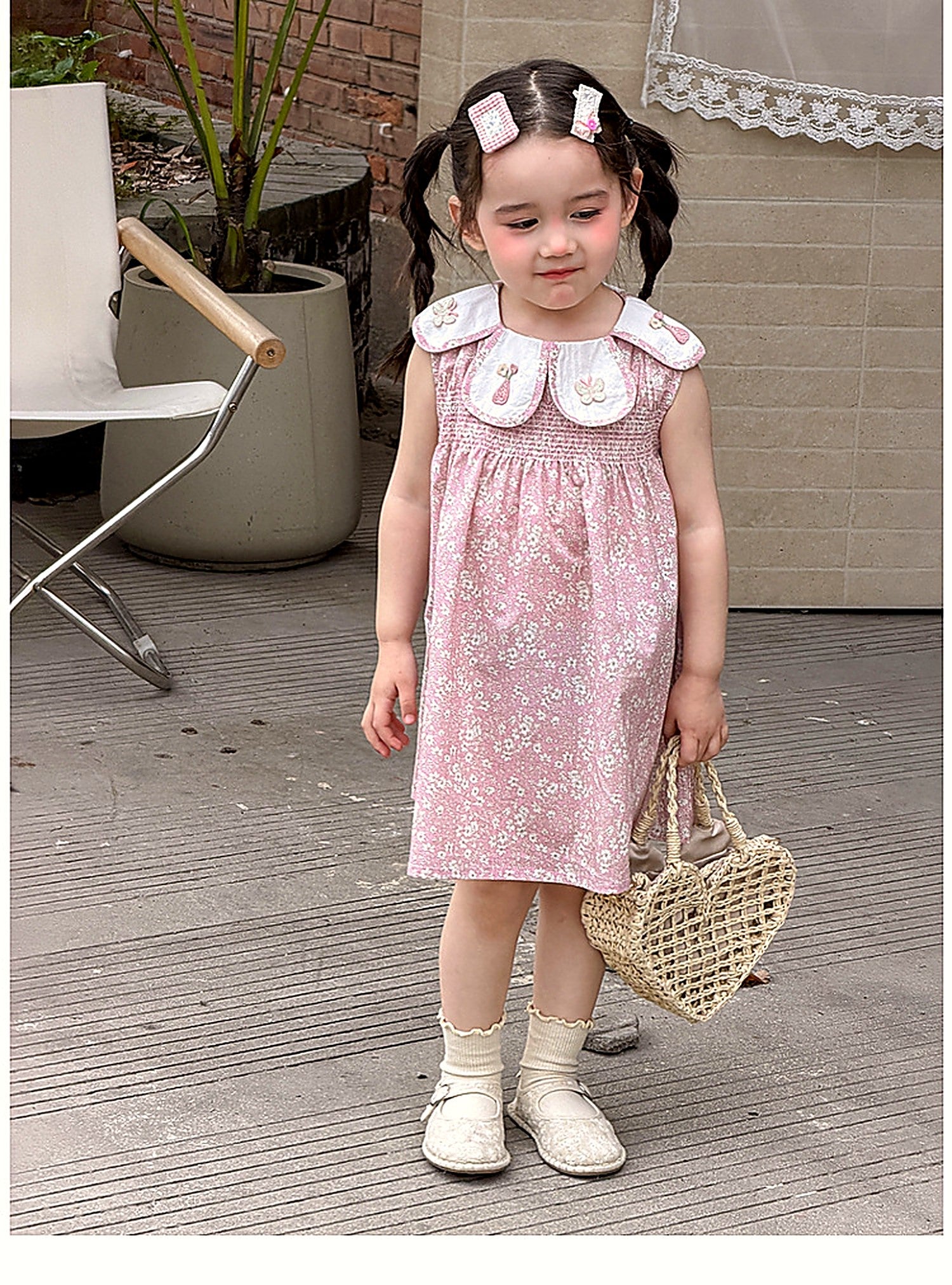 A toddler in the Hazel Dress, soft afternoon light.