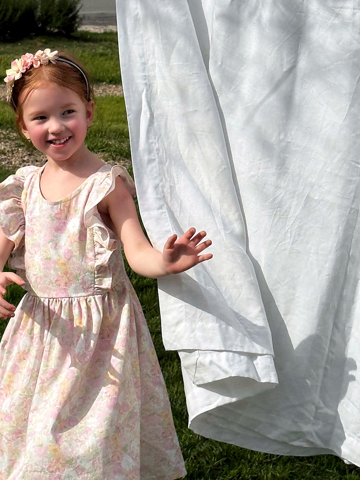 Close view of the Peony Dress bodice and gathered skirt, scattered with little flowers.