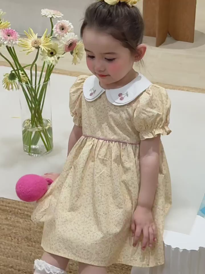 Short film of the Cowslip Dress — butter-yellow with an embroidered doll collar, light for summer.