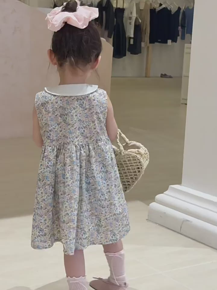 Short film of the Speedwell Dress — sea-mist ditsy floral with a doll collar, light for summer.