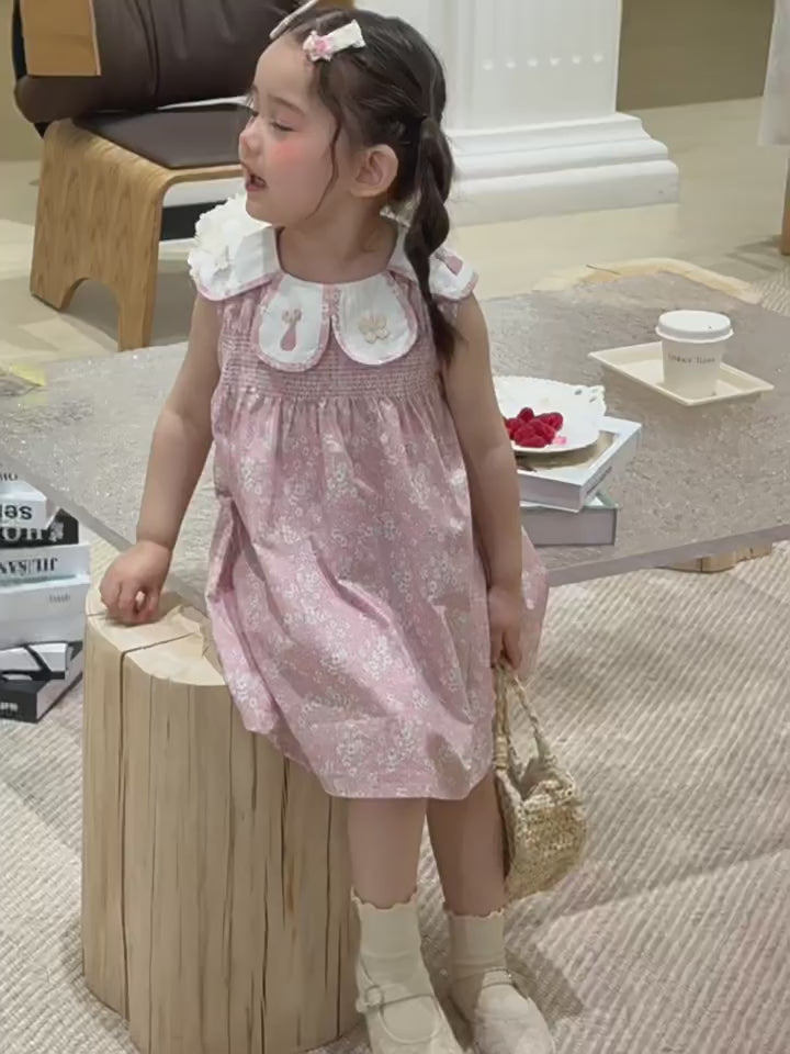 Short film of the Hazel Dress — dusty-pink with a doll collar, sleeveless for warm days.