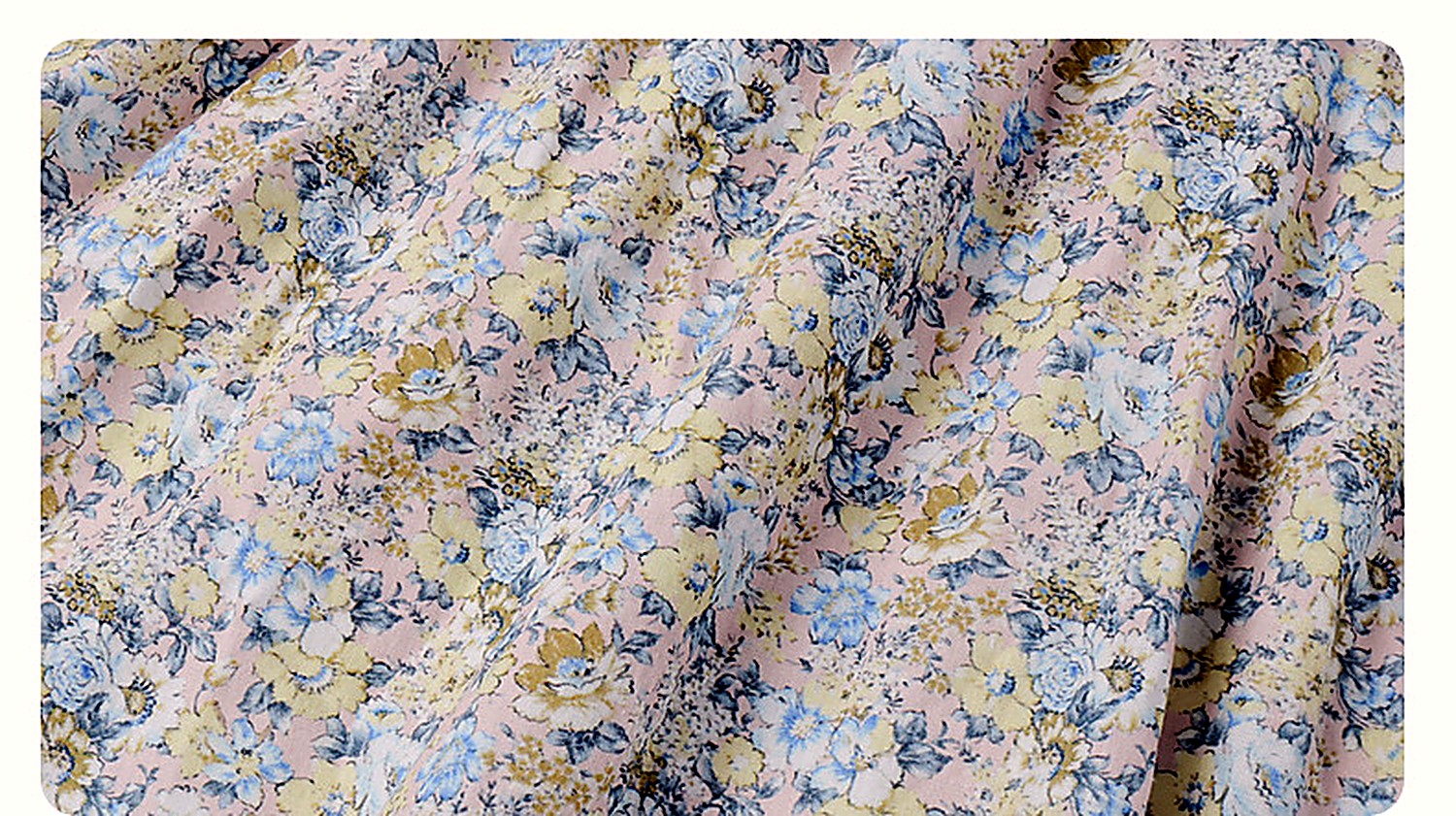 Close detail of the ditsy floral print at the bodice of the Speedwell Dress.